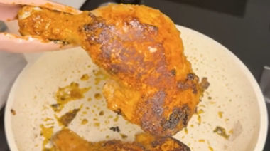 Creamy Iffa chicken coated in rich garlic cheese sauce and garnished with coriander